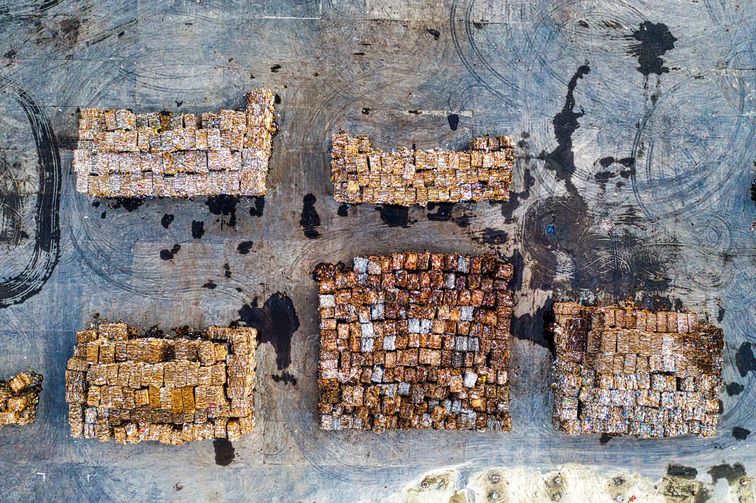 service-1 Aerial shot of organized recyclable material stacks in Serang, Indonesia, highlighting waste management efforts.